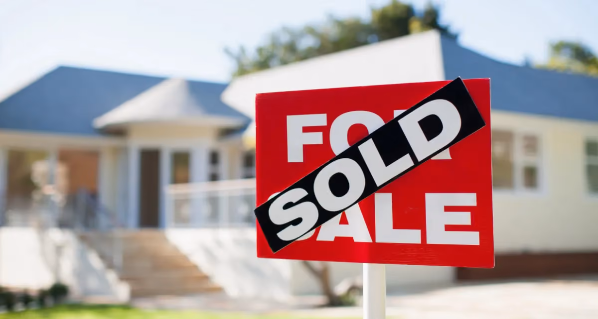 A Sold sign outside a house
