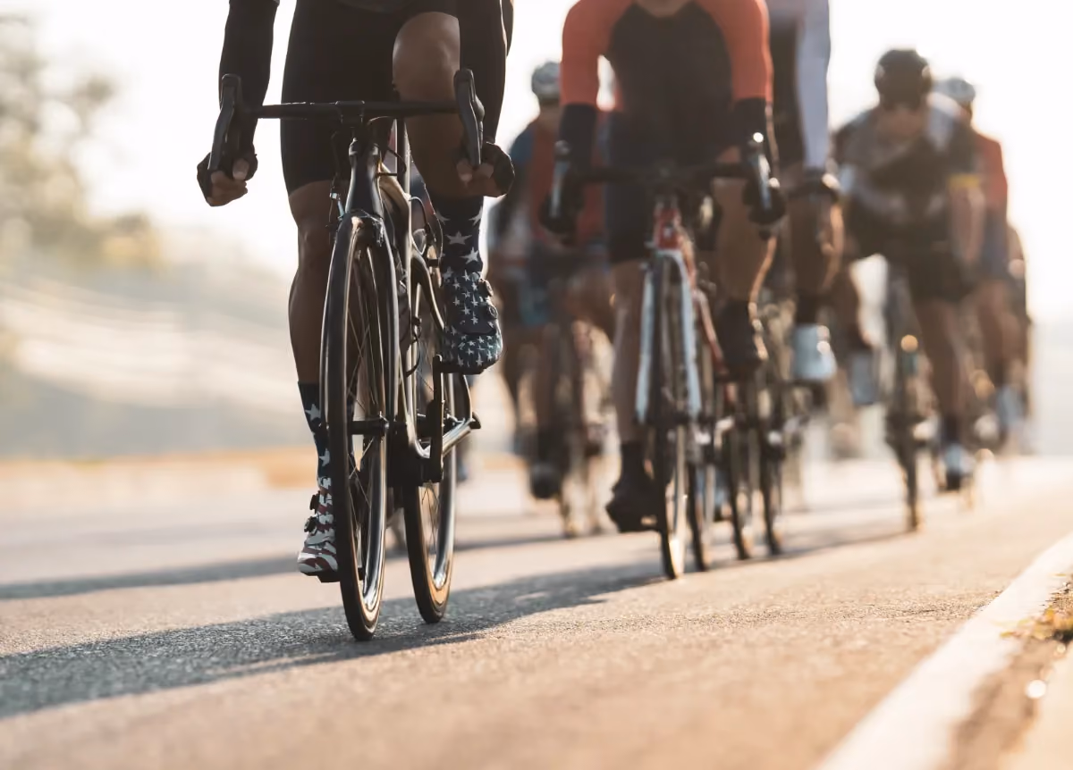 A group of cyclists on the road, seen from a low angle