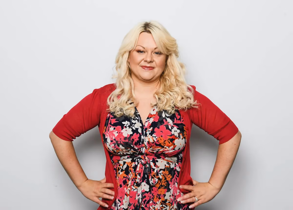 An image of Kate Gregory standing with her hands akimbo