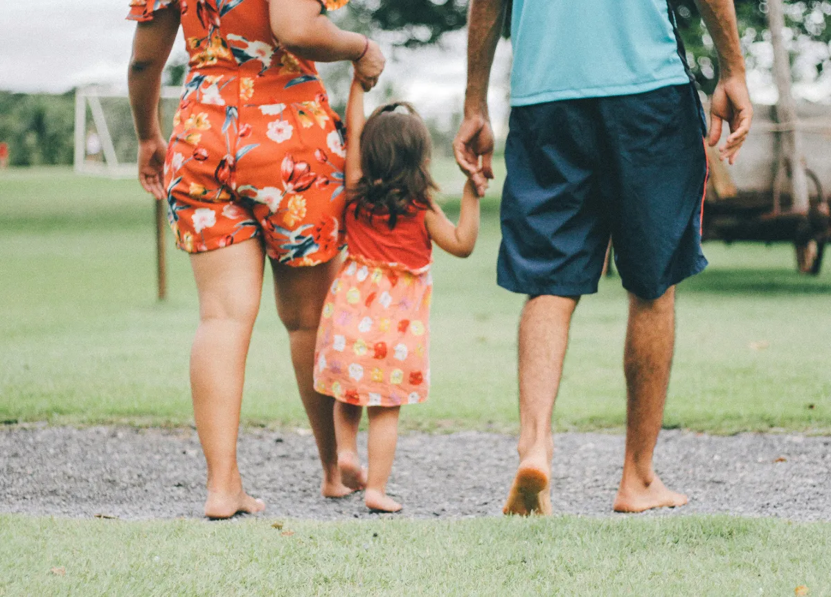 Parents walking with toddler