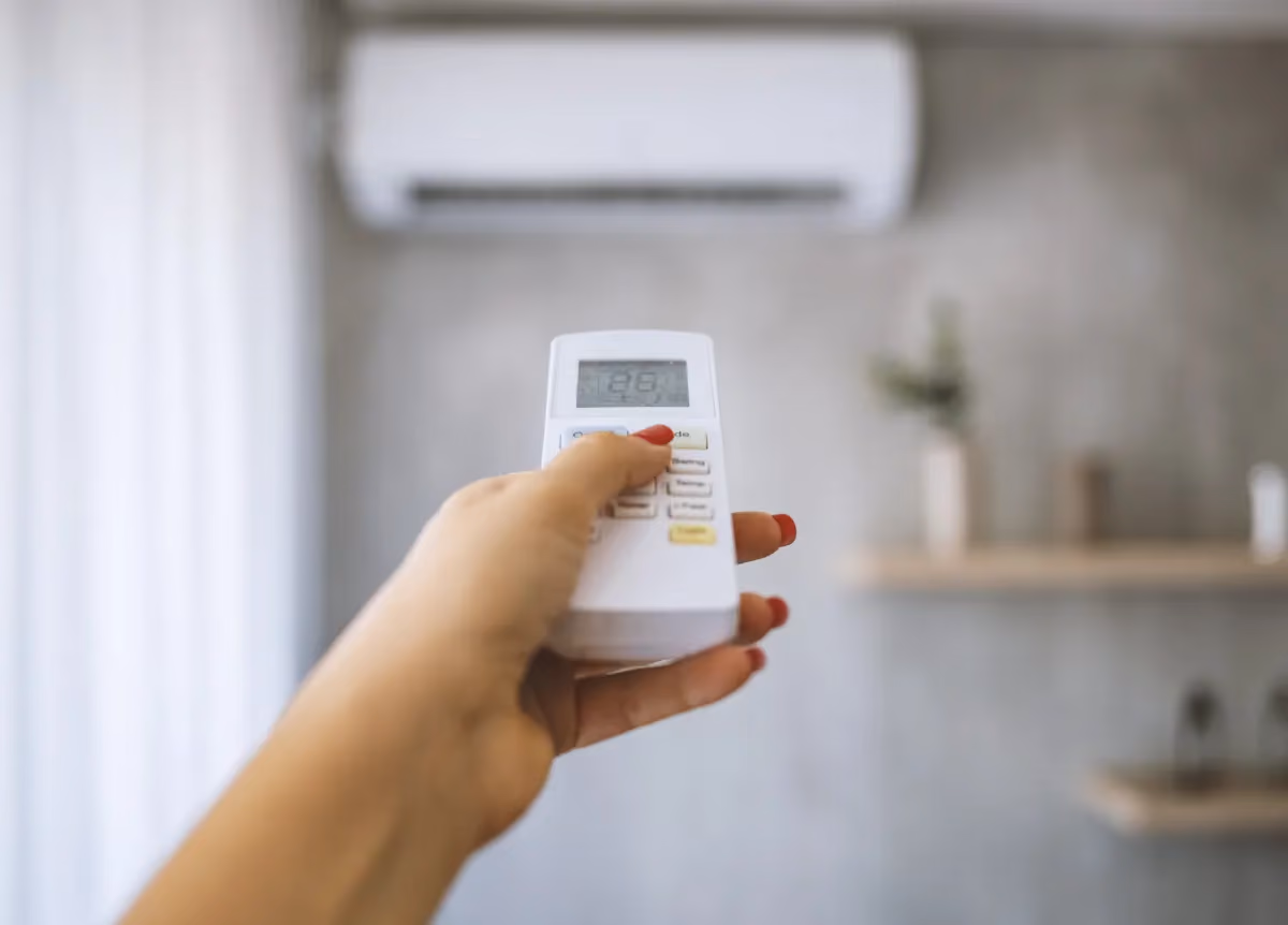 Person using an AC unit
