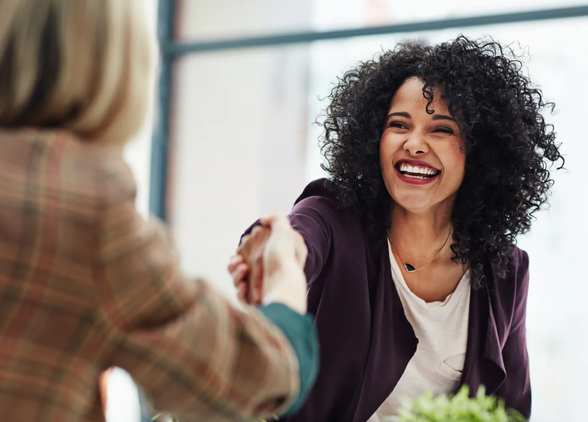 Two businesswomen shaking hands
