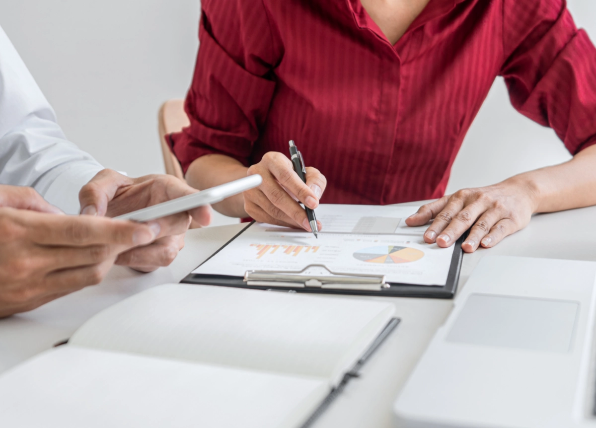 Businesspeople reviewing reports