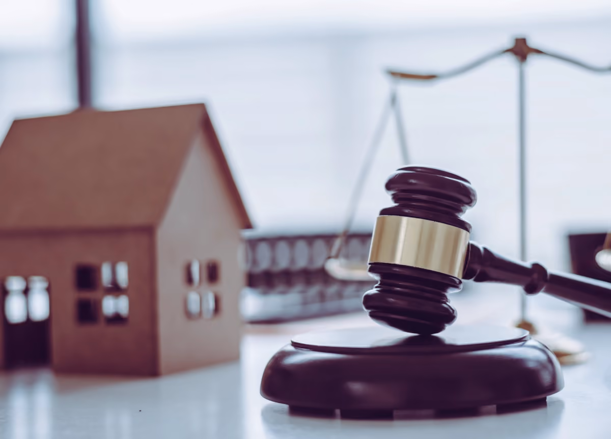 Gavel next to model of a house