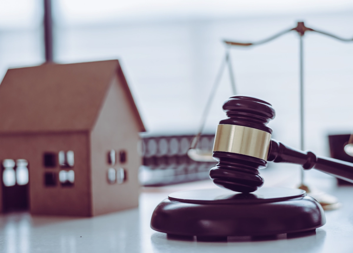 Gavel next to model of a house