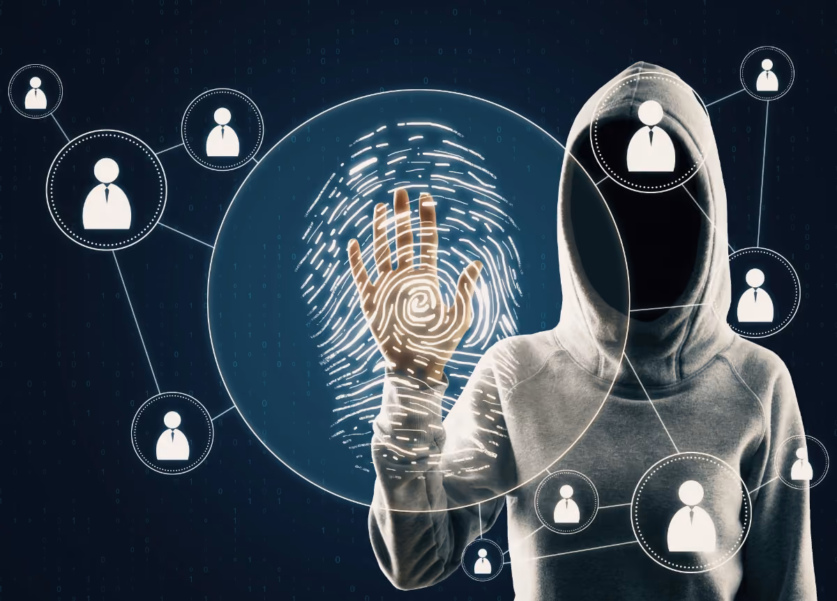 Shadowy hooded figure looking at fingerprints
