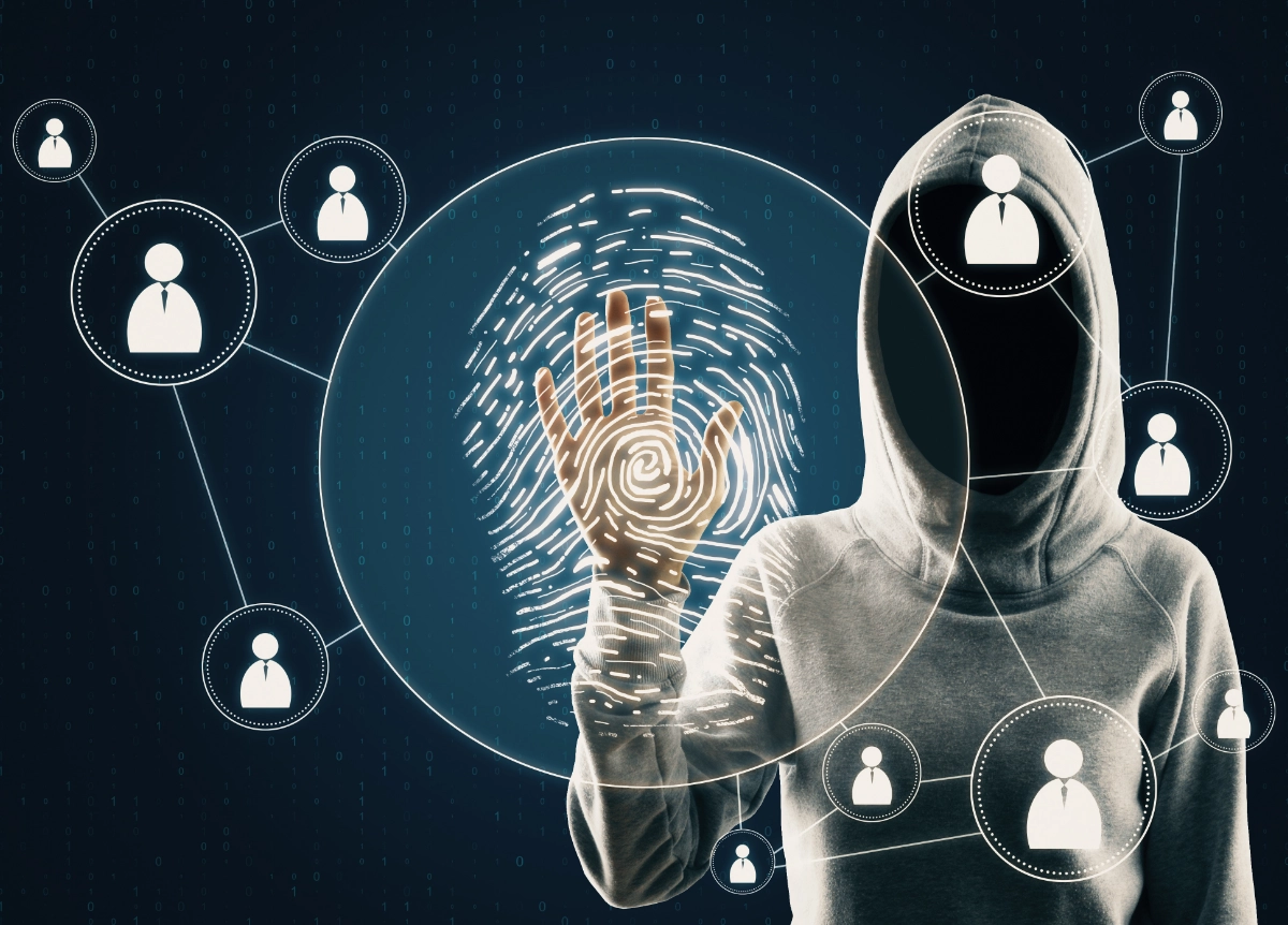 Shadowy hooded figure looking at fingerprints