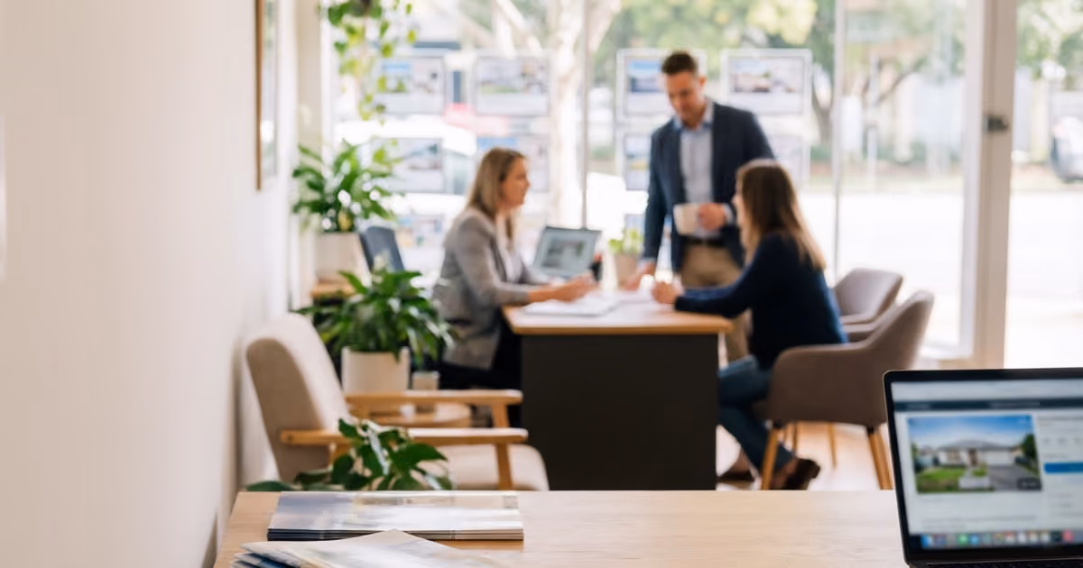Group of people sitting together in a letting agency 