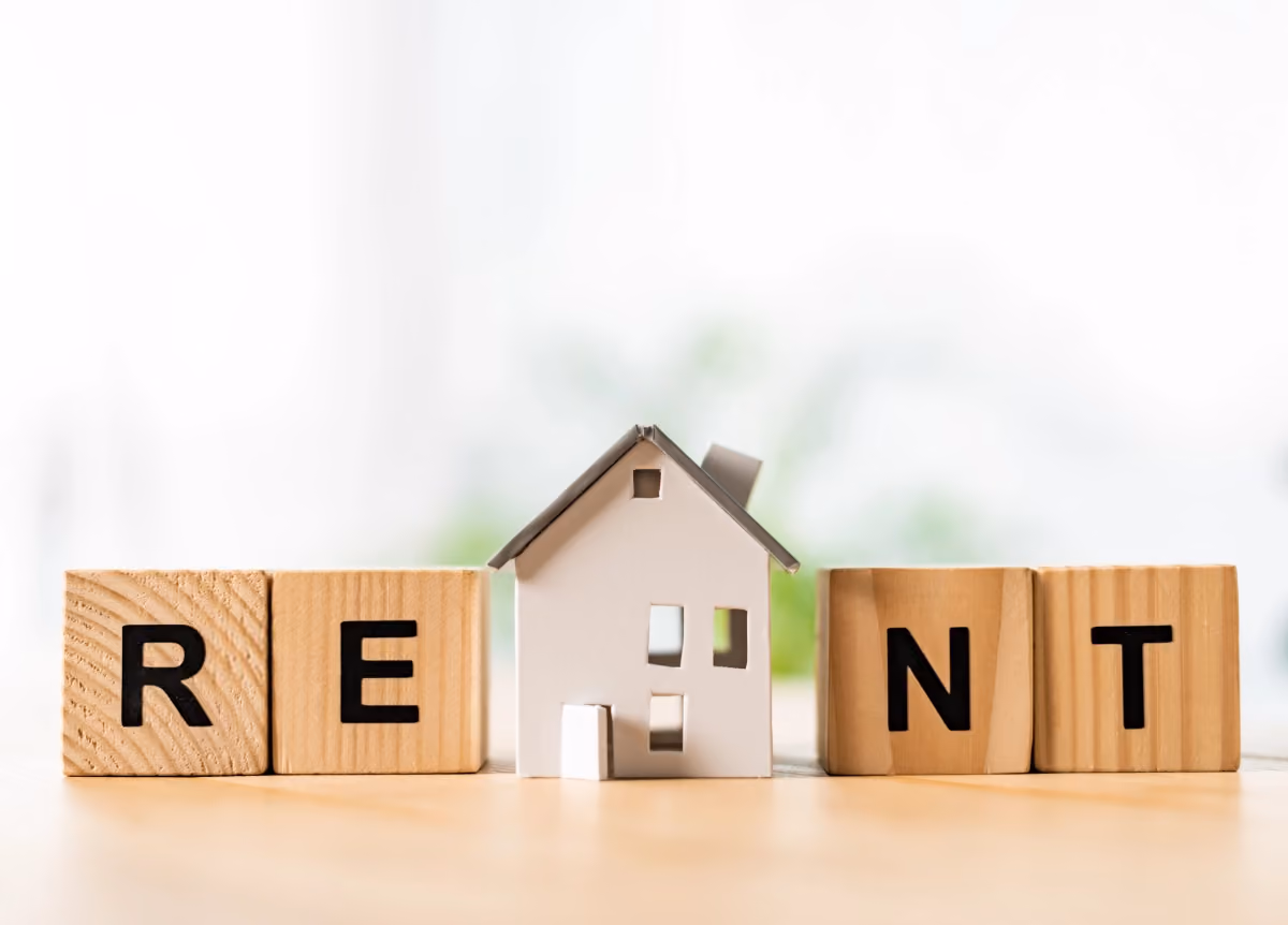 "Rent" spelled on wooden blocks