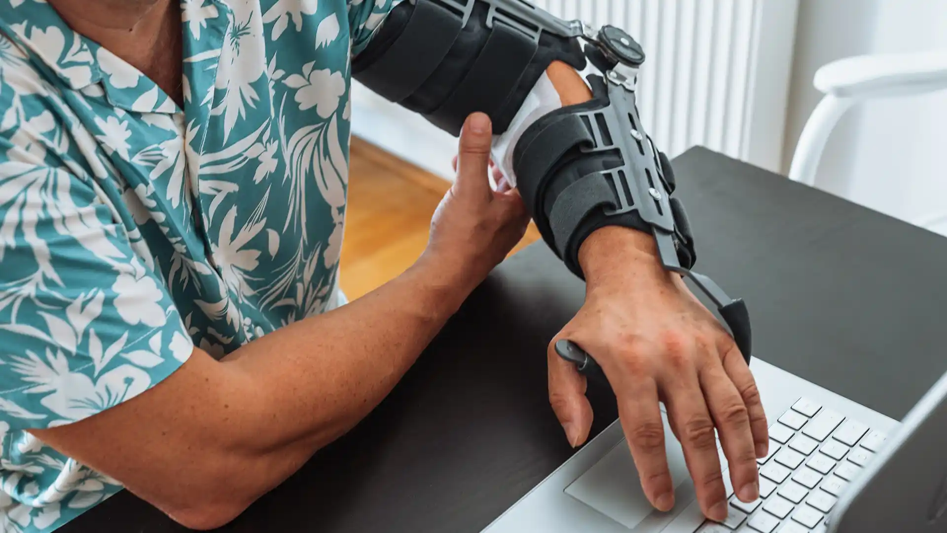 A person using assistive tech to work on a computer