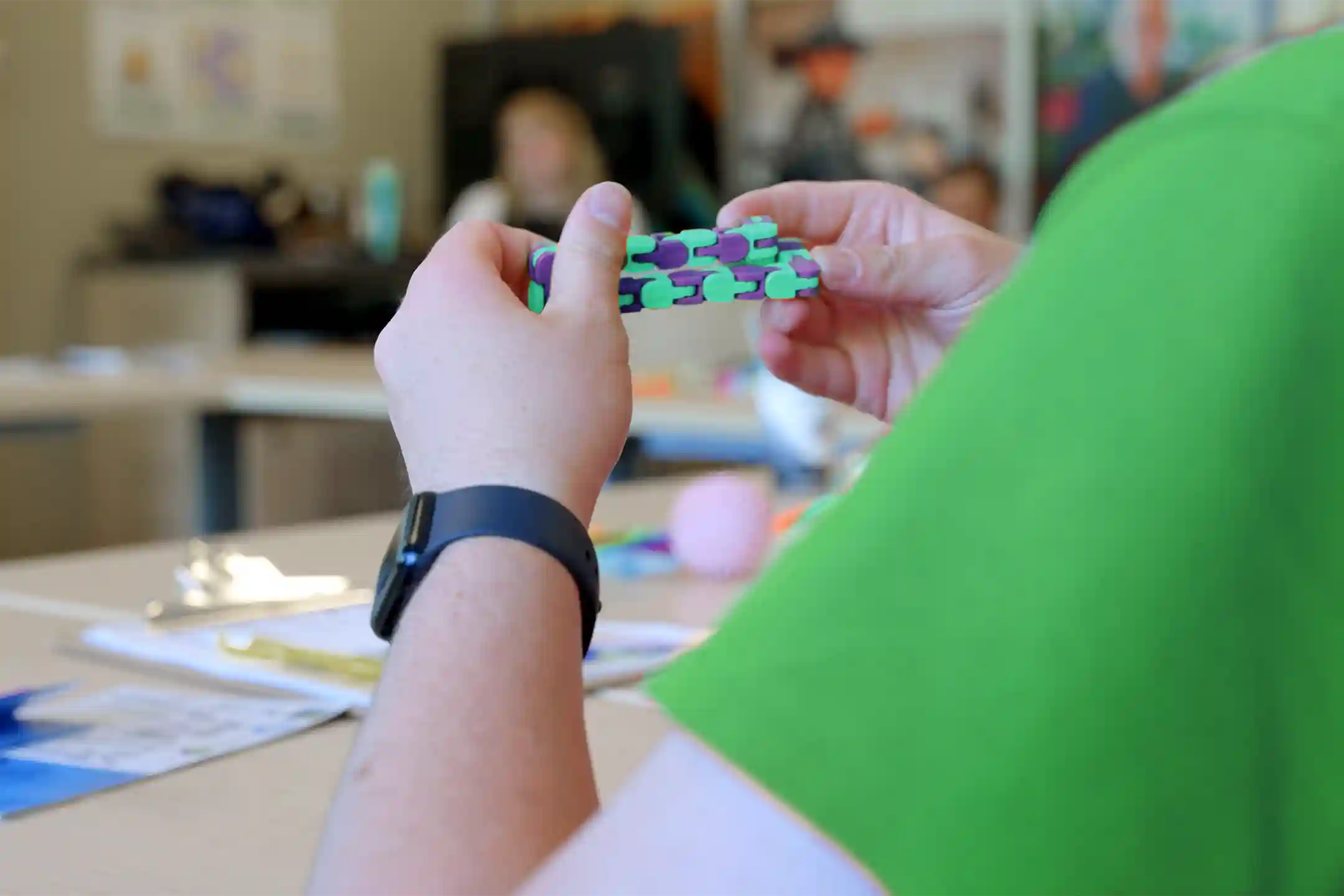 A program participant using a fidget toy