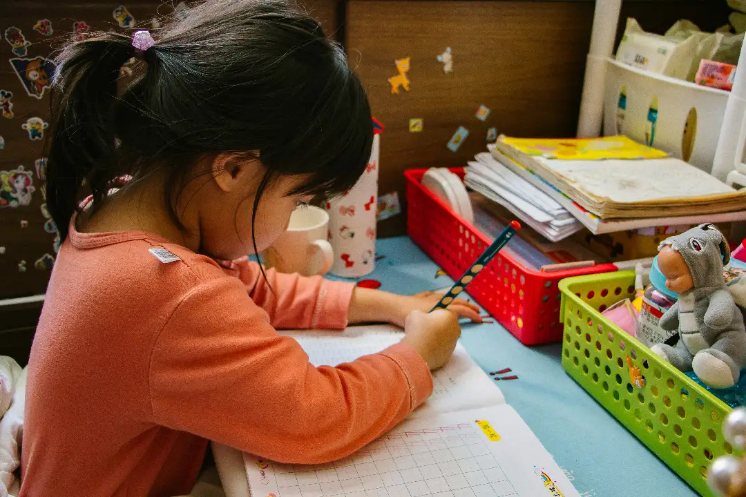 A child drawing in a daycare setting