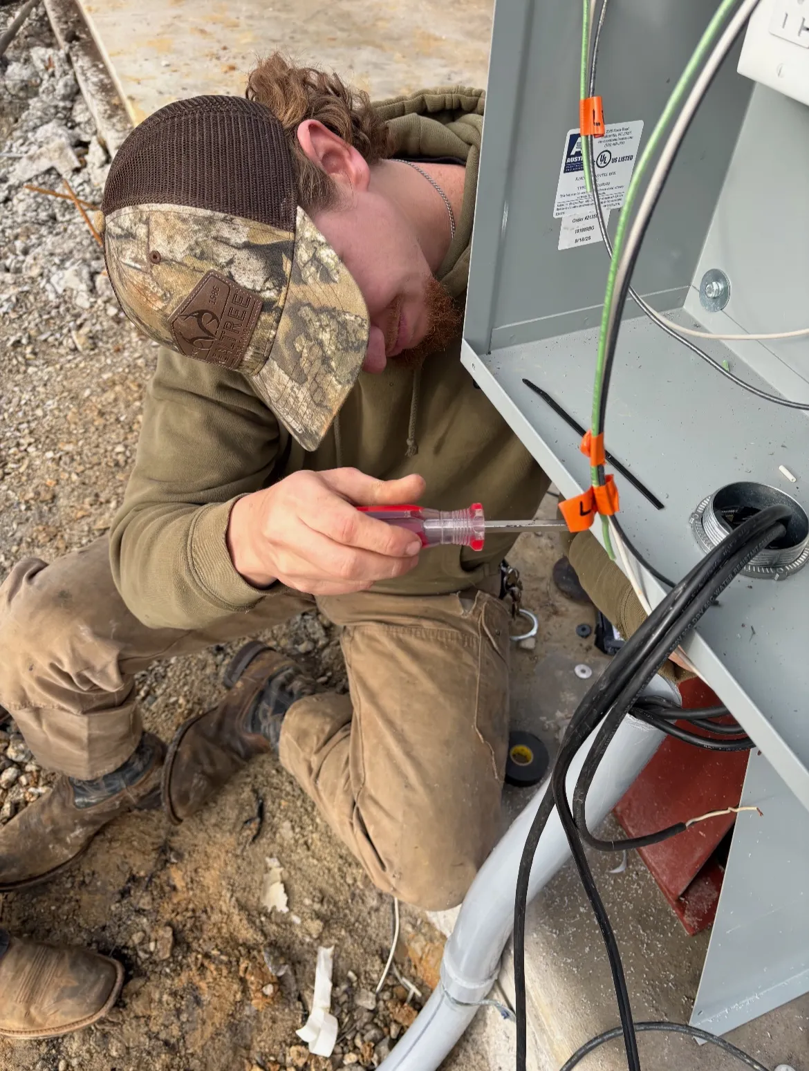 SmithBros Electrician working on an panel box