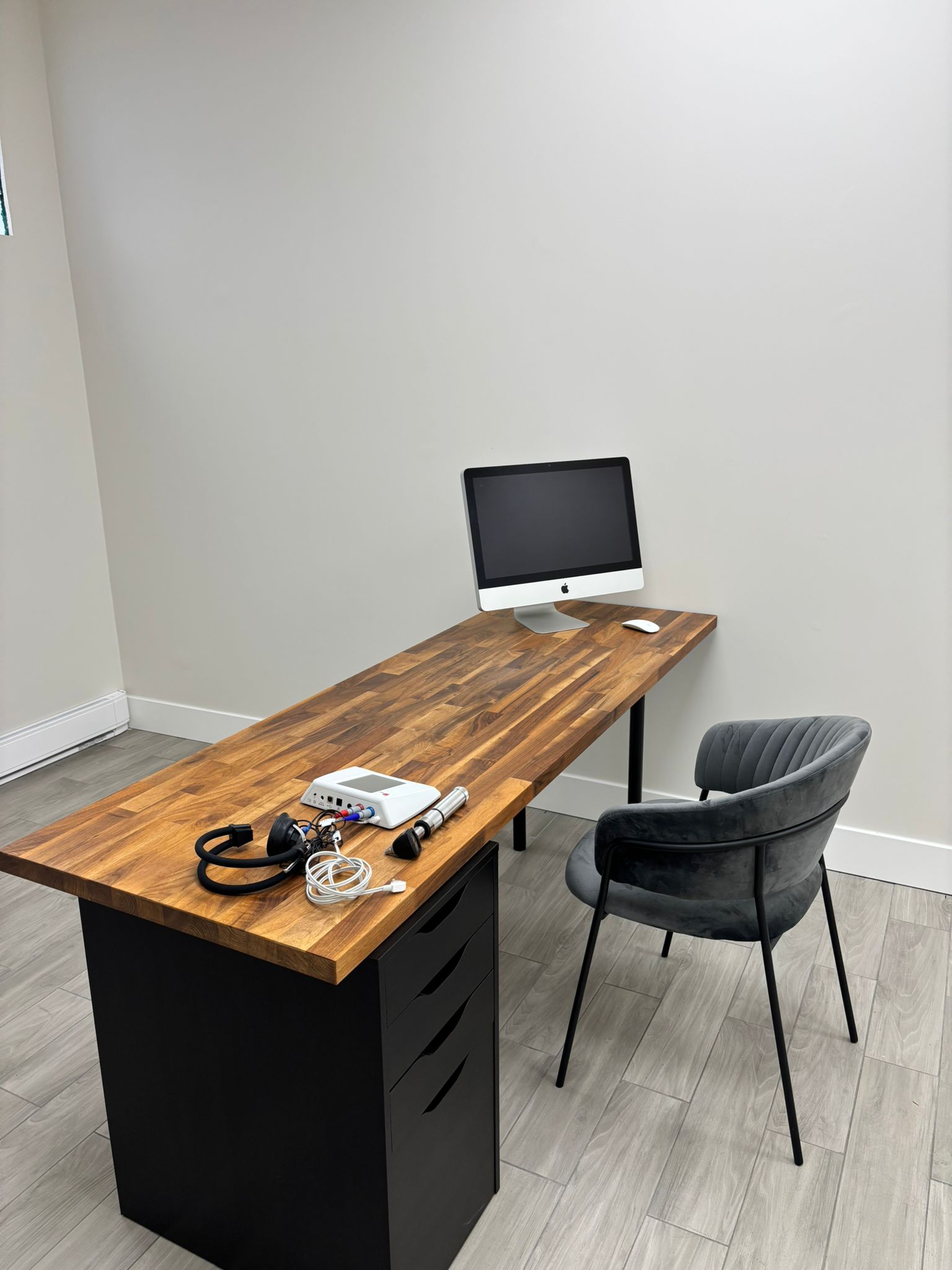 A desk with a laptop on it
