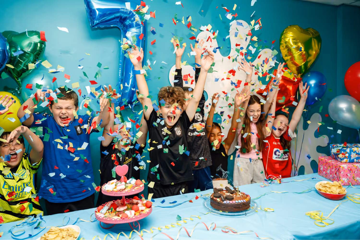 Children celebrate with excitement, balloons, confetti, and birthday cakes