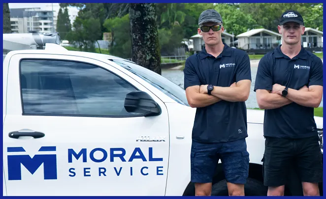 Shaun & Justin standing in front of work ute