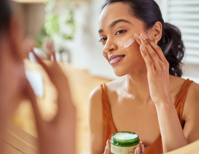 Woman applying cream