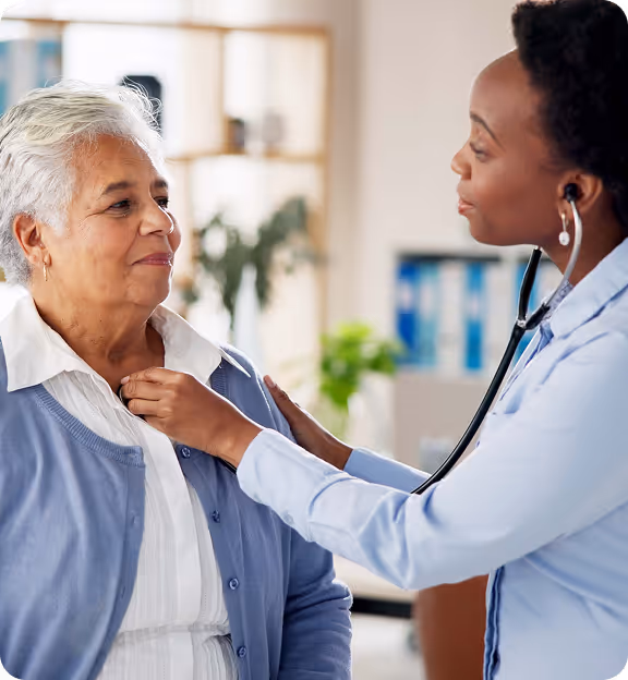 a doctor examining an old woman