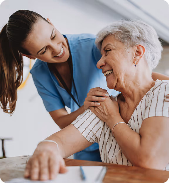 a woman smiling at a woman