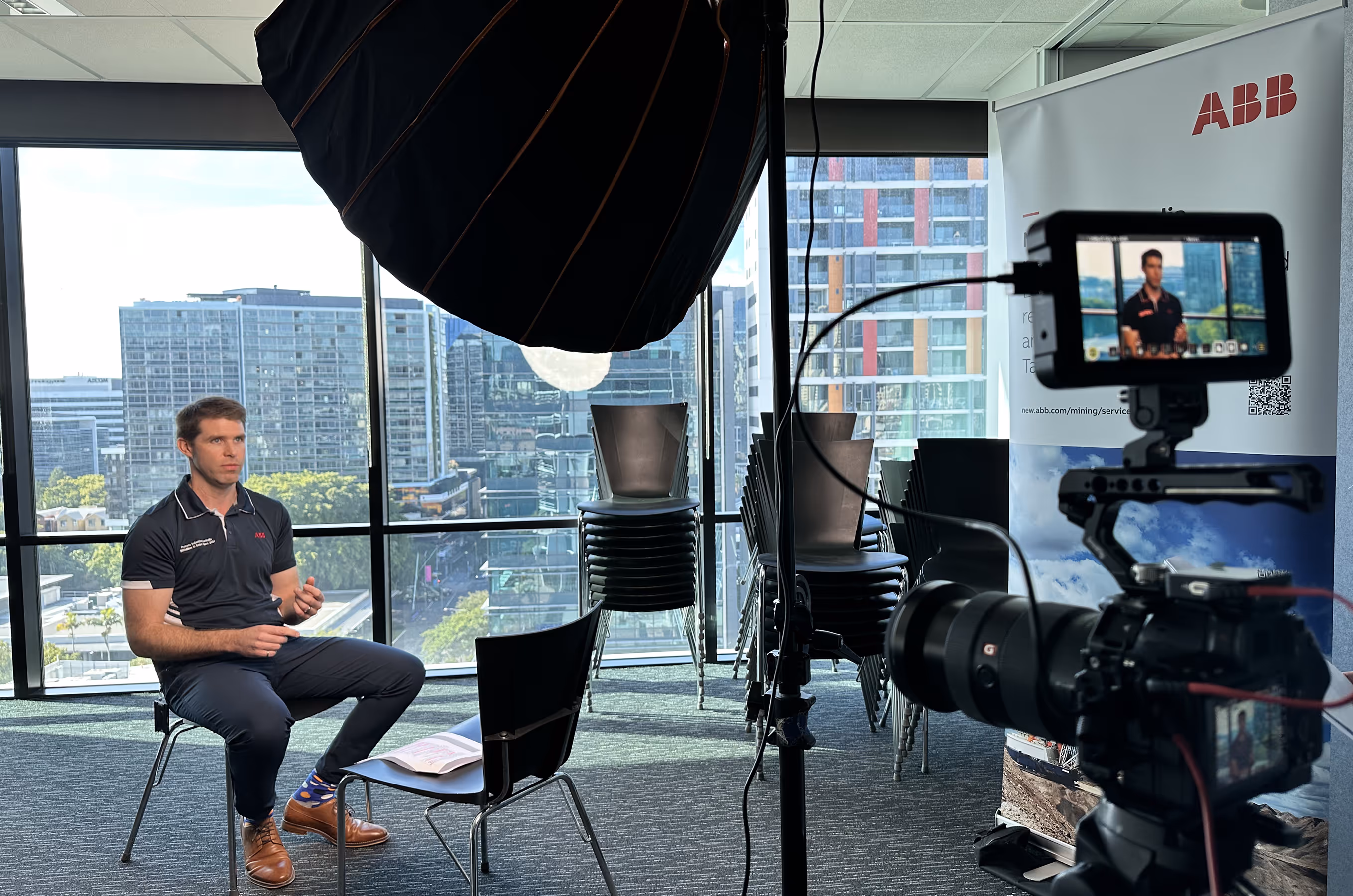 Videographer at work on a branded video production set, demonstrating NK Creative's commercial videography capabilities.