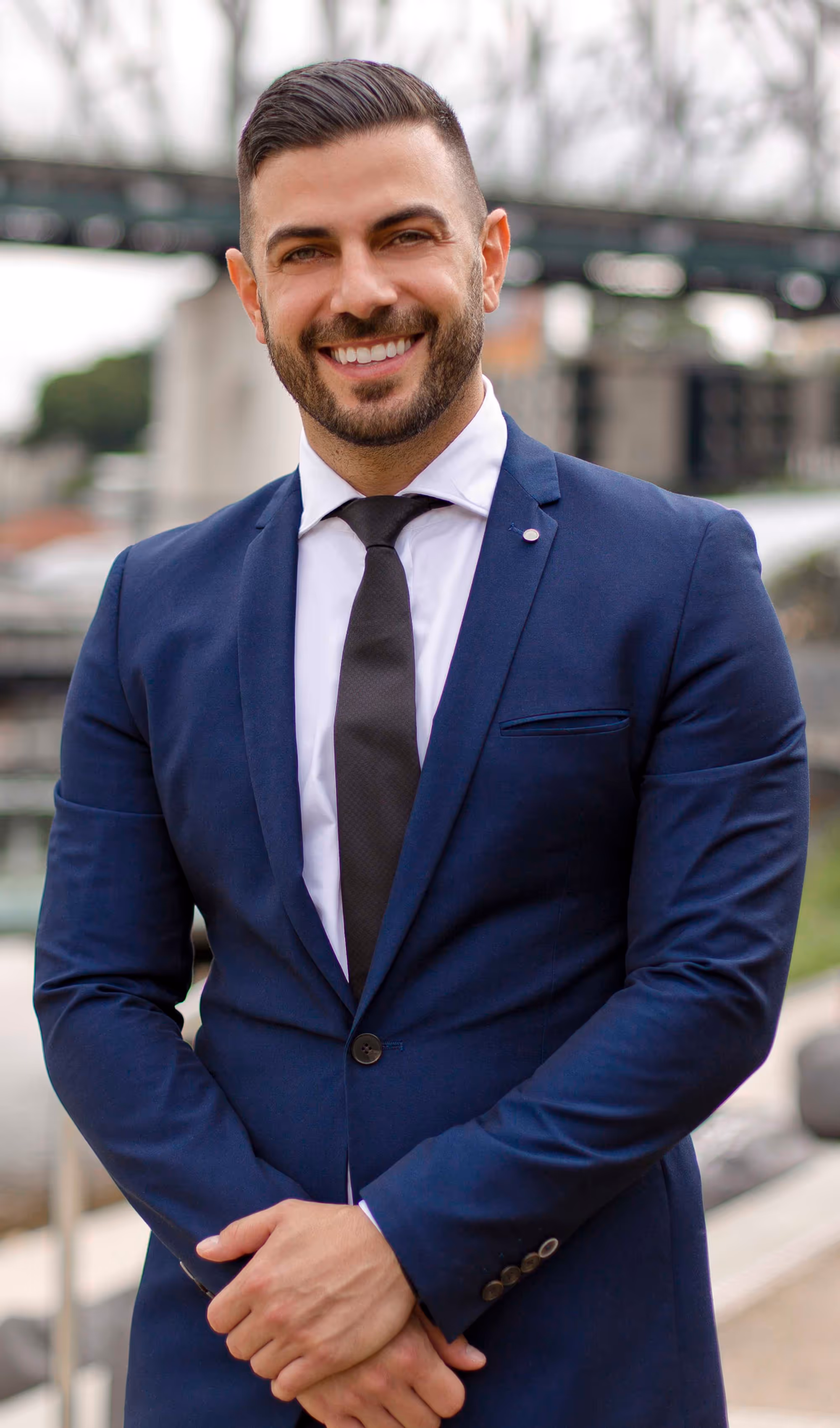 Polished corporate headshot of a man in navy suit, crafted for first impressions and professional networking.