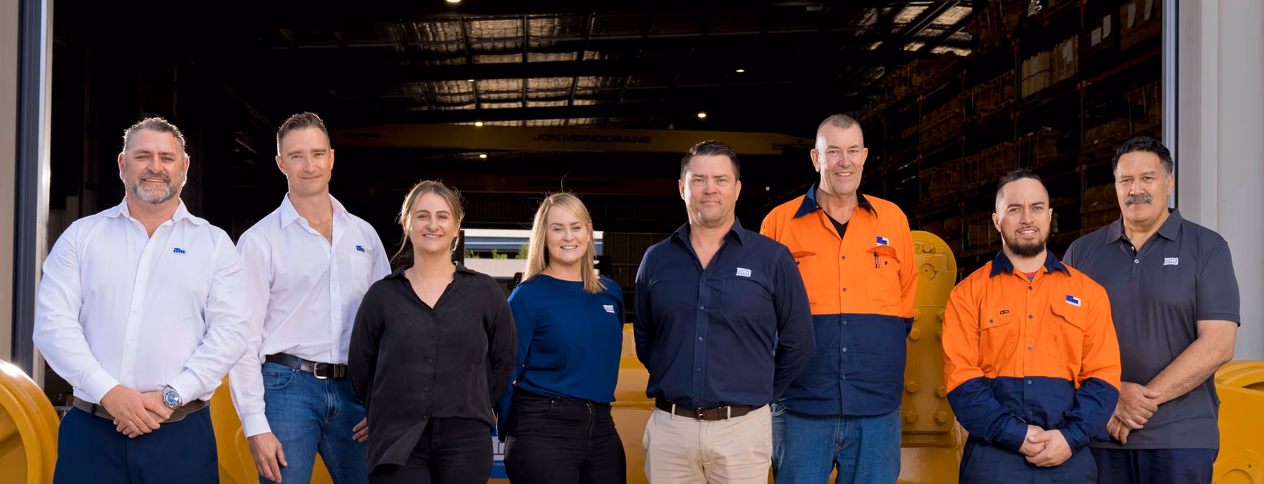A group photo of mans with two beautiful ladies.