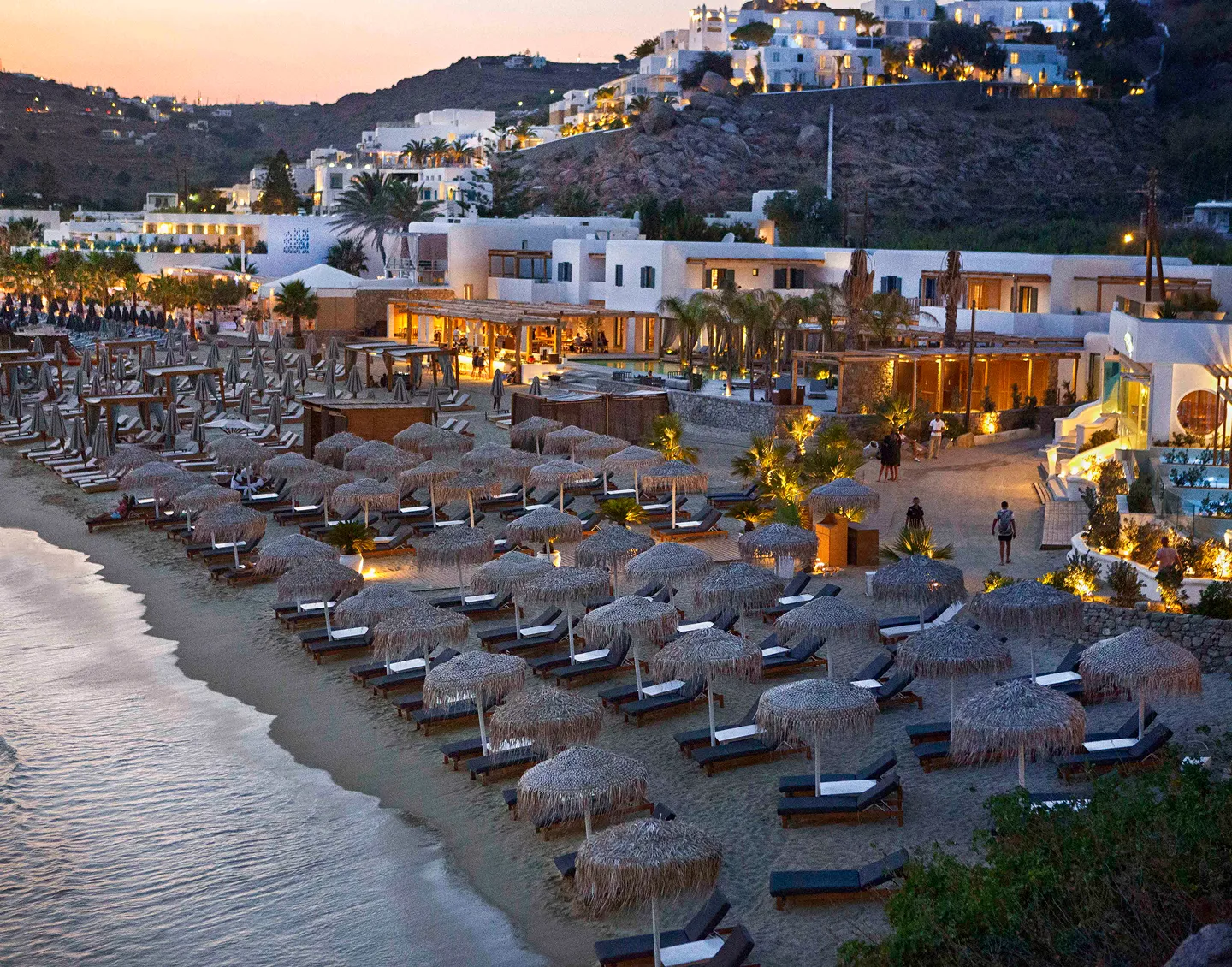 A Beautiful view of a sea view showing the chairs near that to sit in to see sea view.