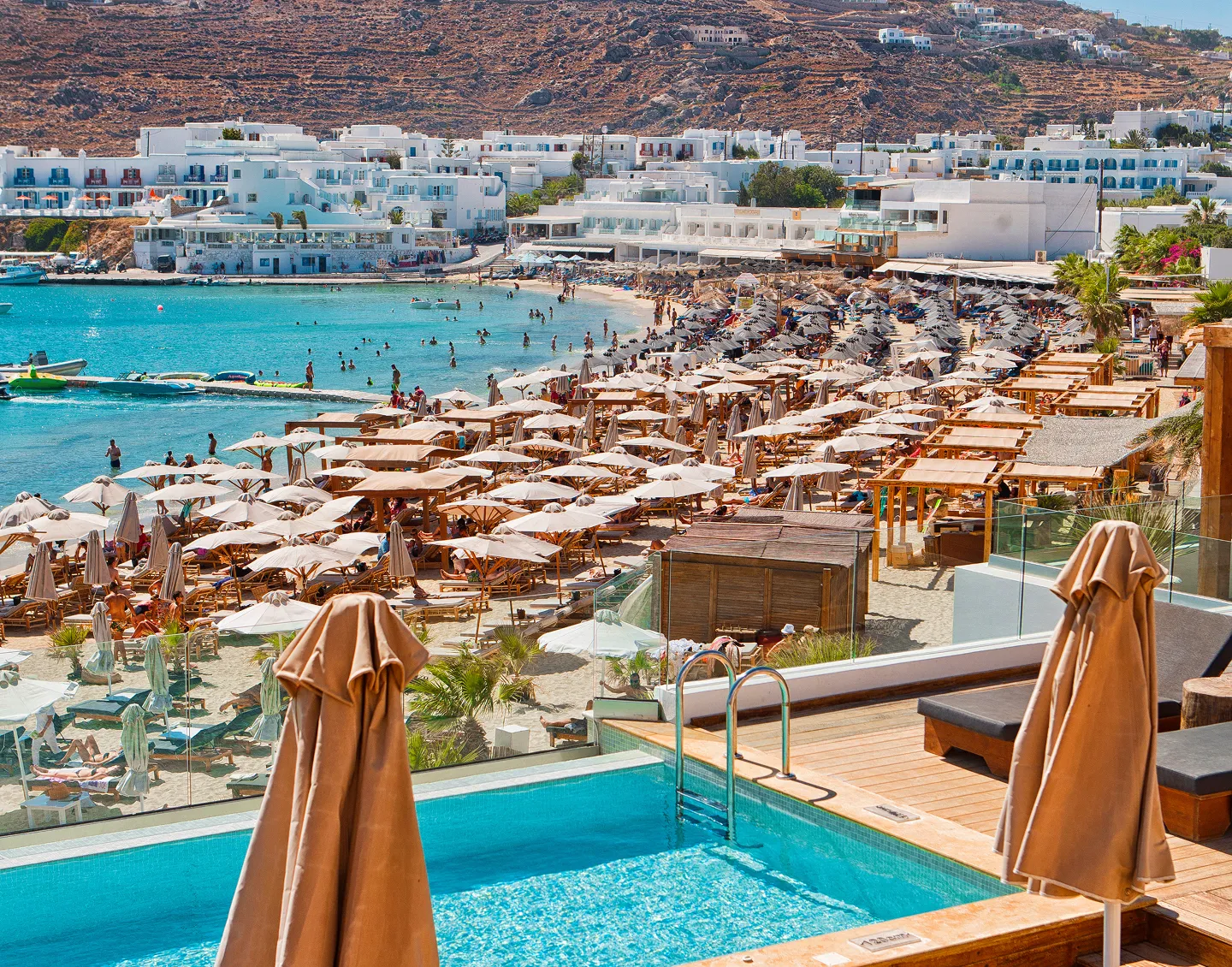 A Beautiful view of a sea view showing the chairs near that to sit in to see sea view.