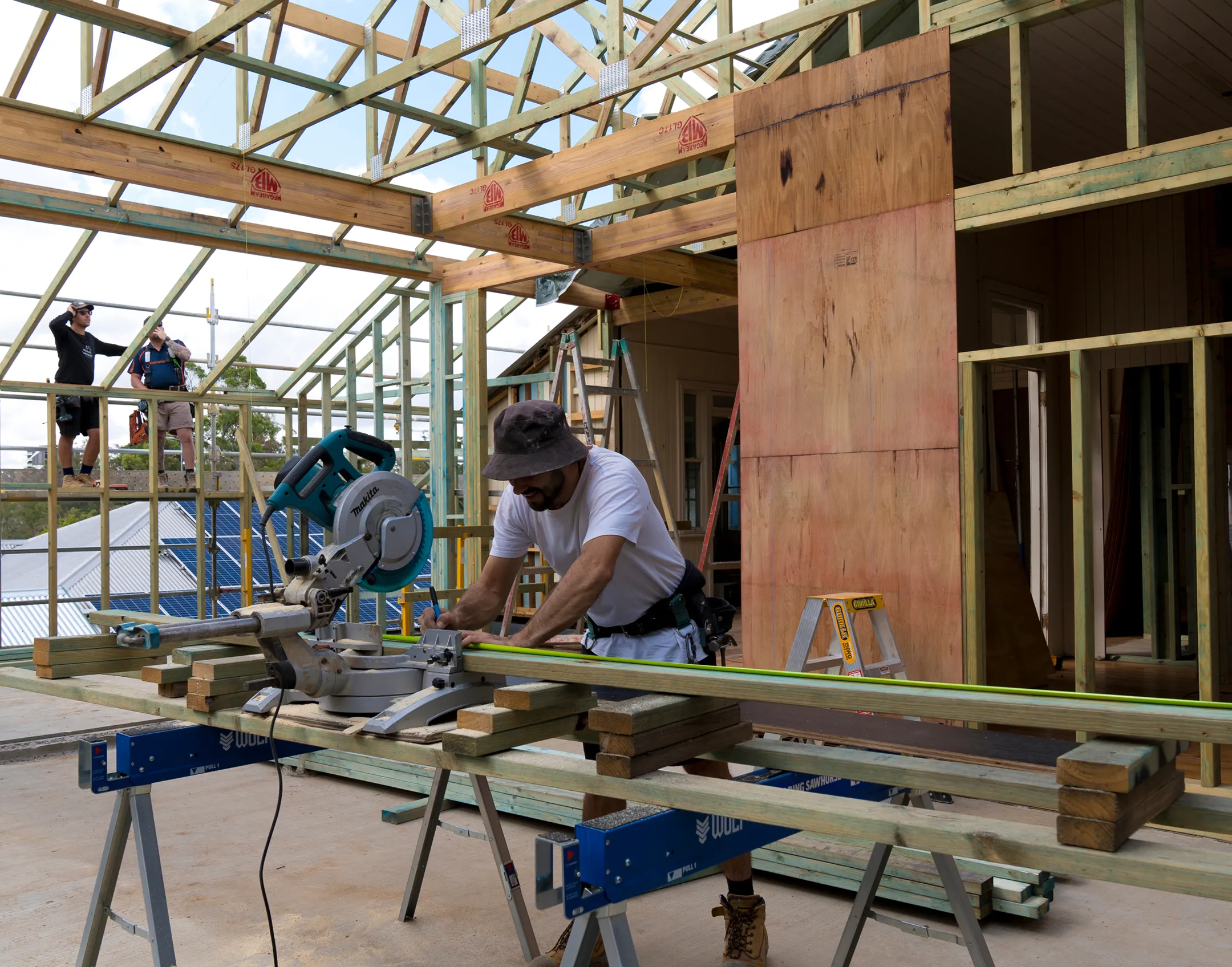 A photo of a constructor while while he is working .