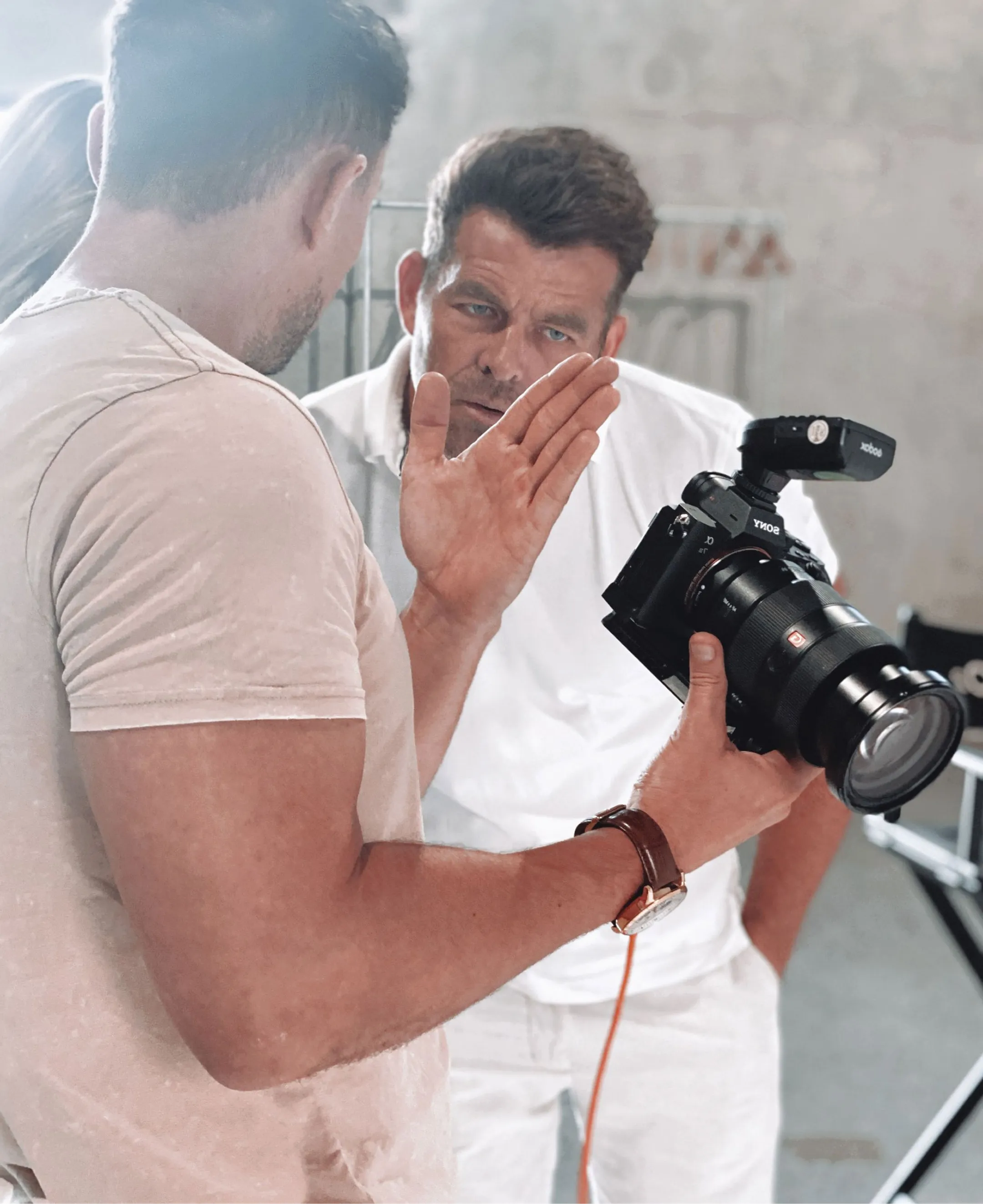 Professional videographer in action with camera, representing NK Creative's expertise in reliable, high-quality content creation for Brisbane clients.