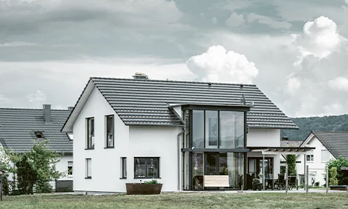 Tele-Aufnahme Haus mit Wintergarten von HAUSER.