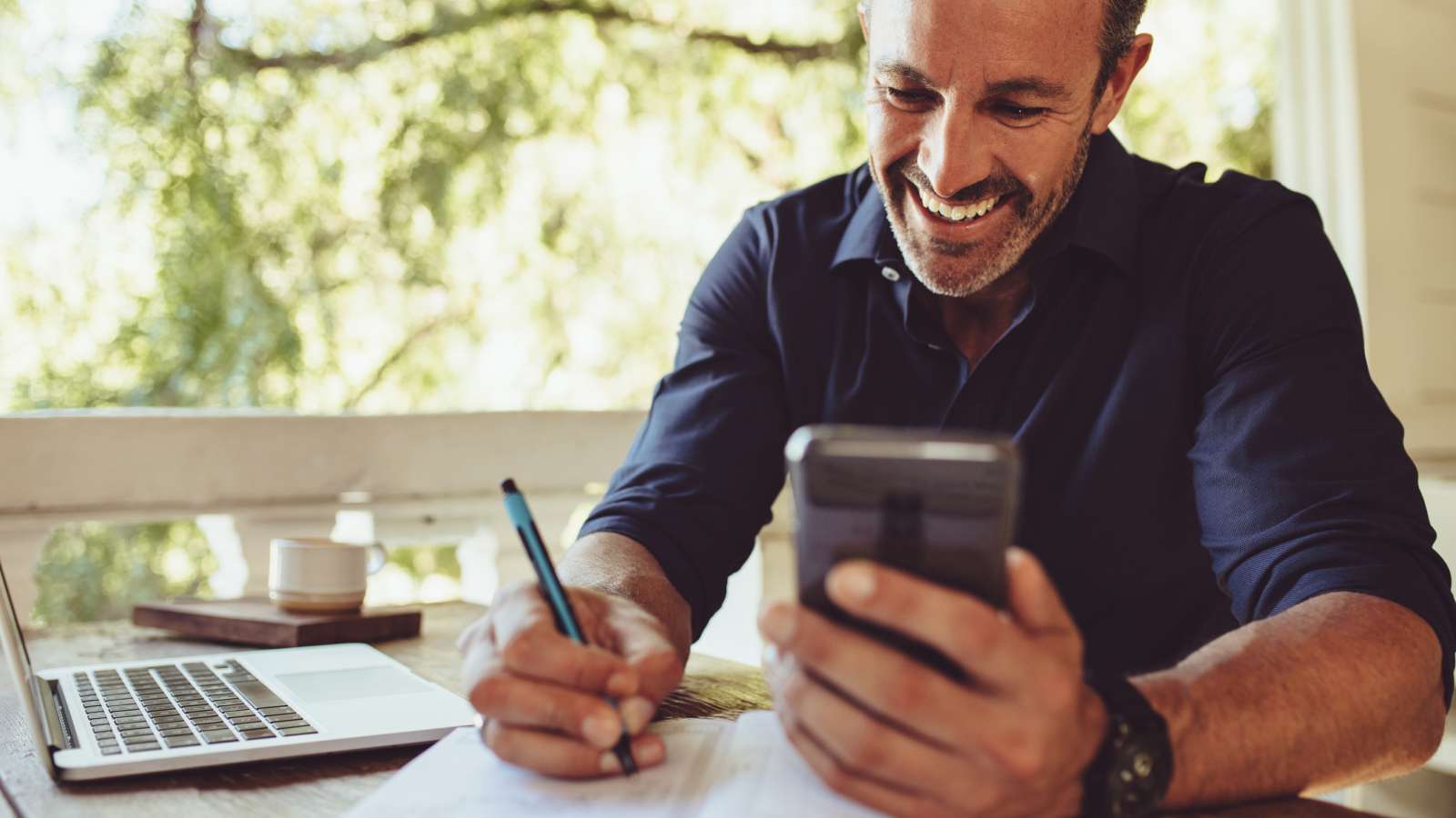 Hero image for the Initial Consultation page - a man on a handheld device