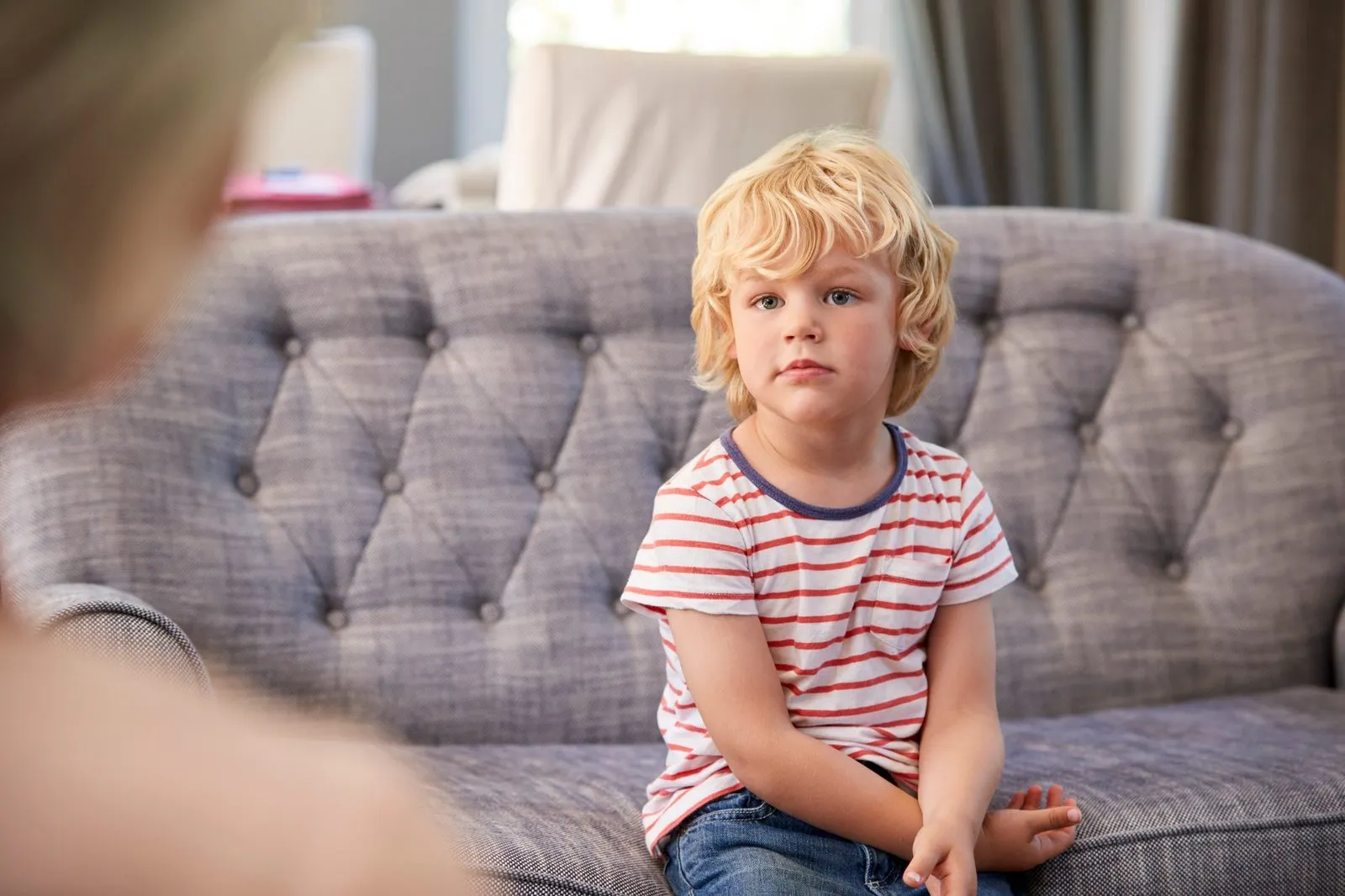 a child sitting on a couch