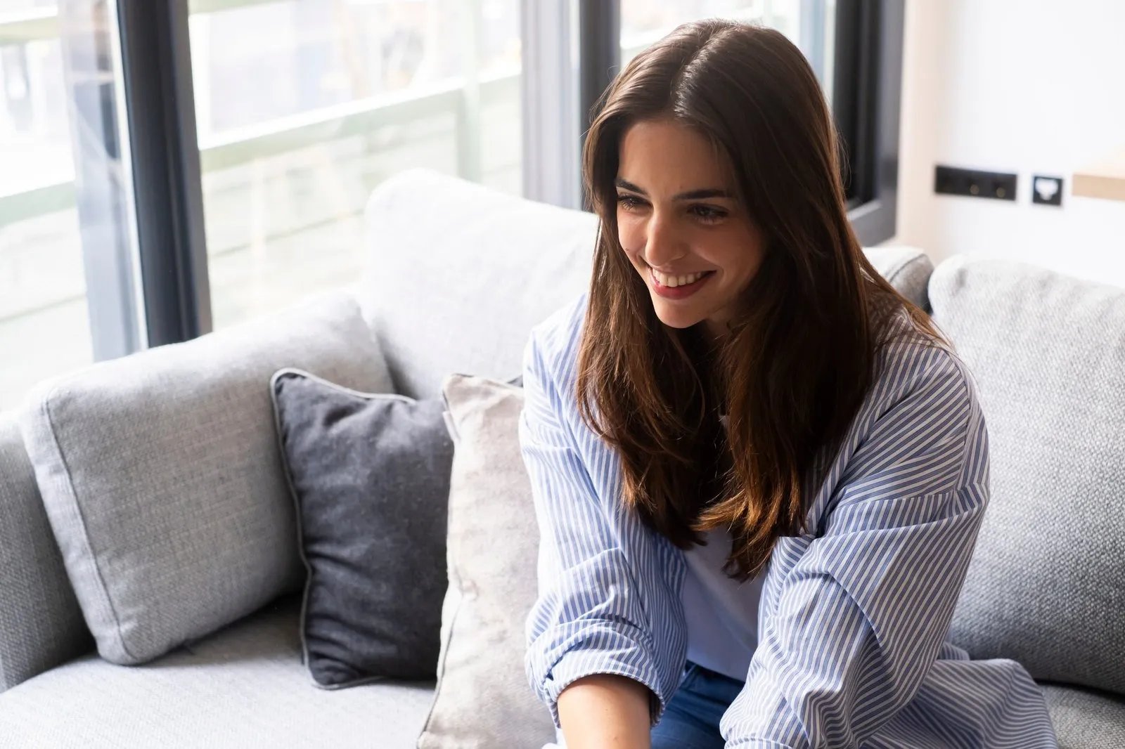 a woman sitting on a couch