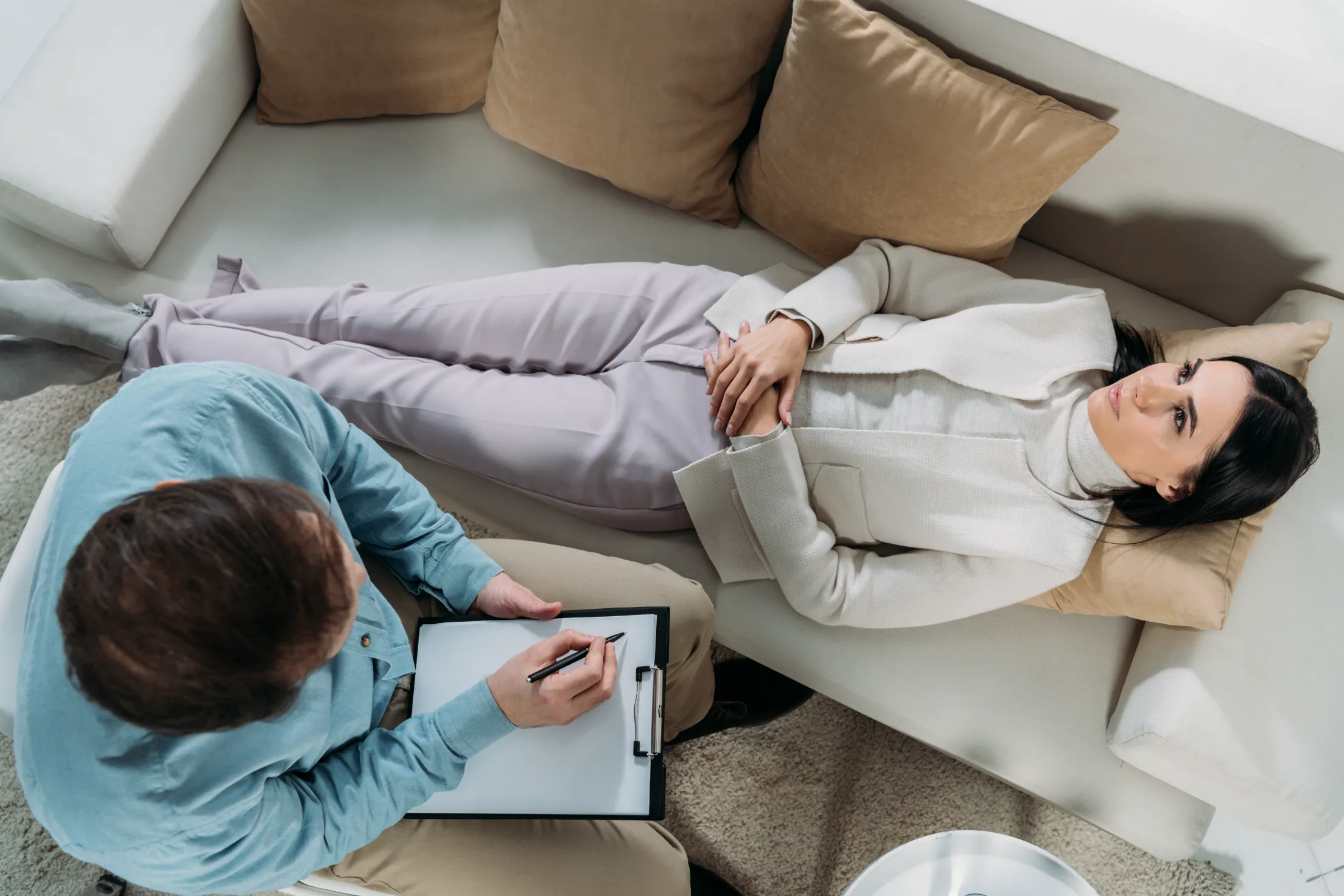 a man and woman sitting on a couch