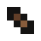 Four small, brown crumbs scattered on a black background.