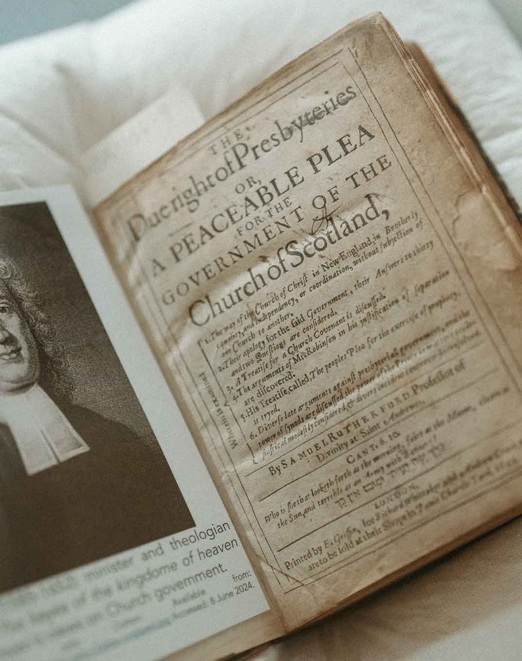 Open old book titled 'The Due right of Presbyteries or, A Peaceable Plea for the Government of the Church of Scotland' beside a black and white portrait on a page.