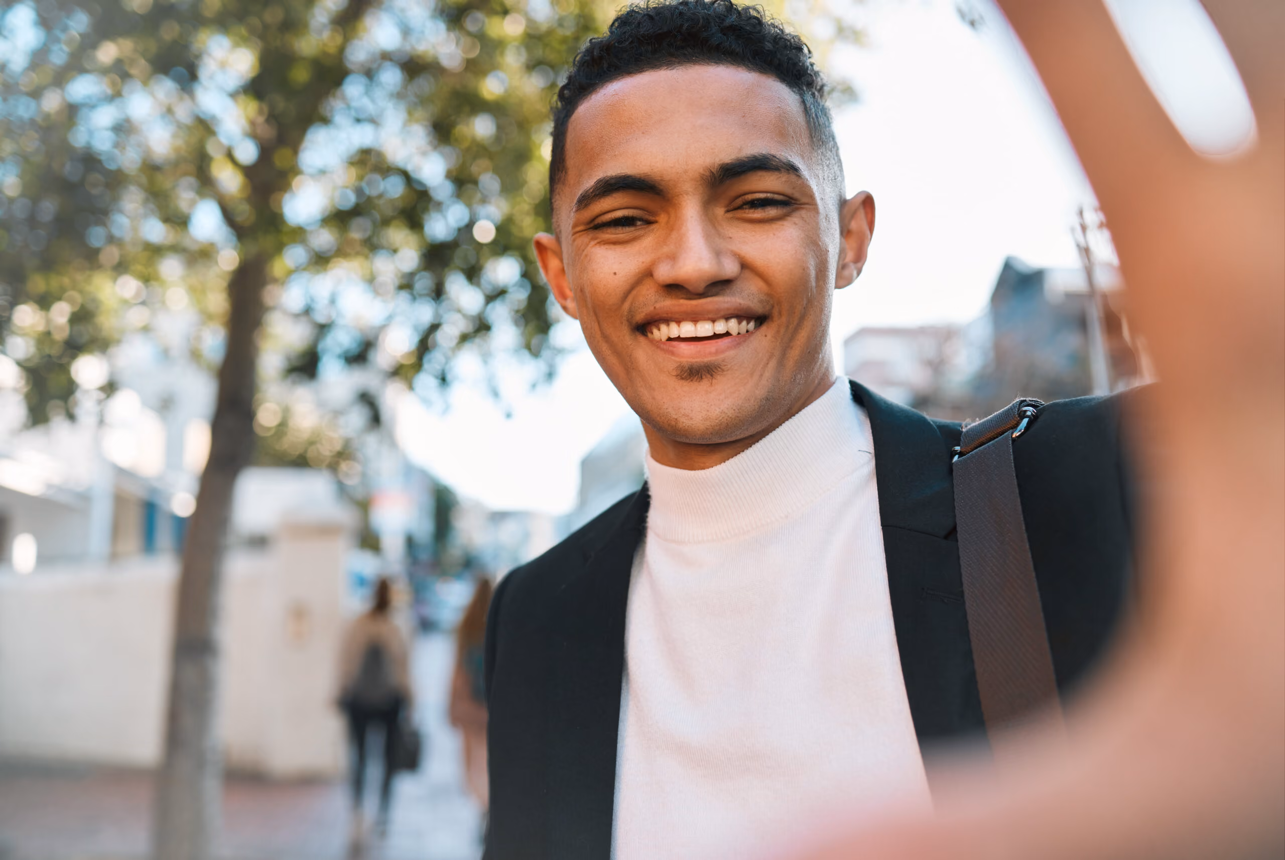 Person smiling while looking directly at the camera