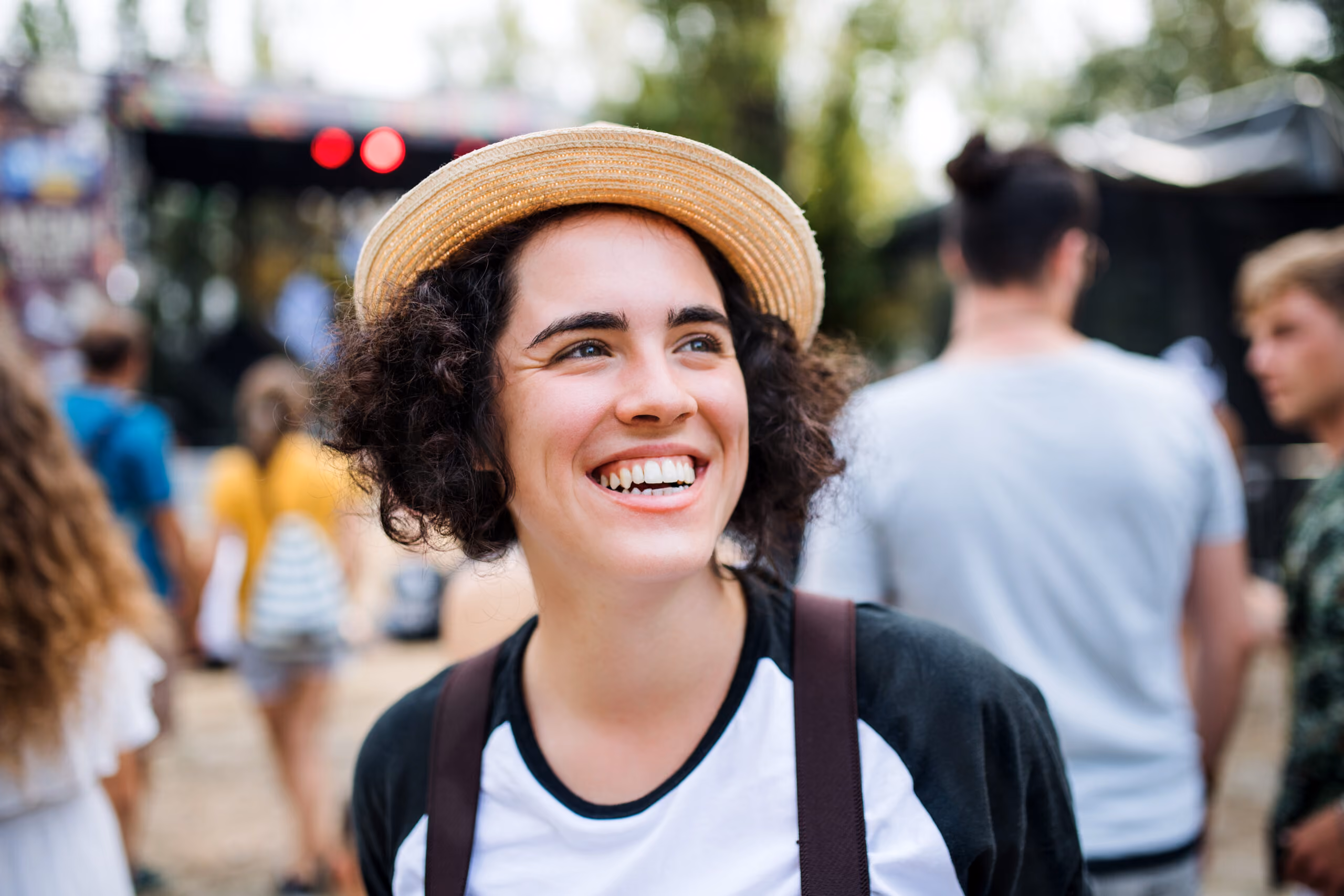 Person smiling looking off into the distance