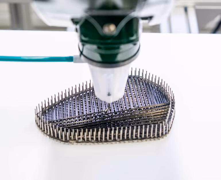 IFP lays up a continuous fiber to produce a dry laminate