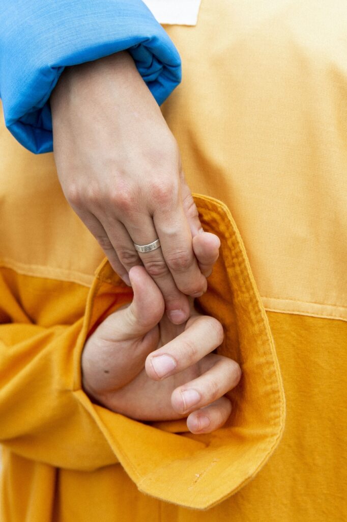 Two people holding hands