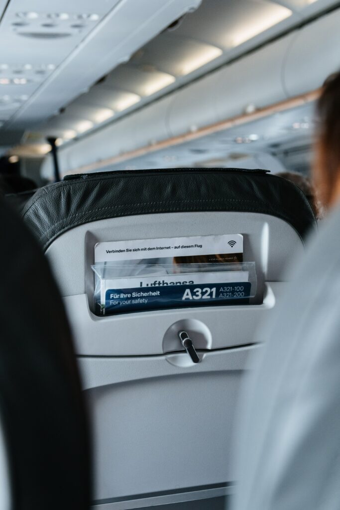 A seat on a Lufthansa plane. When travelling with your medical cannabis prescription, keep it in your hand luggage to avoid damaging it. If you vape your medical cannabis, check that your accommodation is happy for you to use your vaporiser indoors or whether there are designated areas.