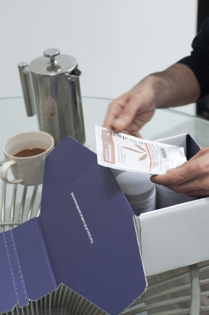 Patient opening their Mamedica prescription delivery
