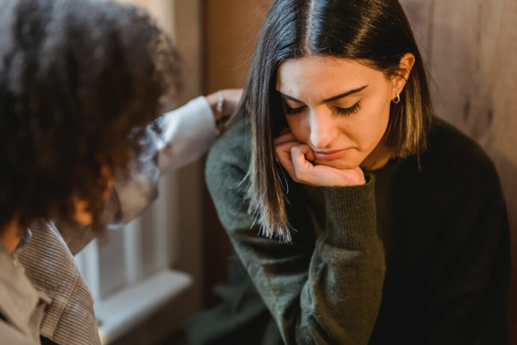Post-Covid Anxiety & Cannabis. A person being comforted by a friend.