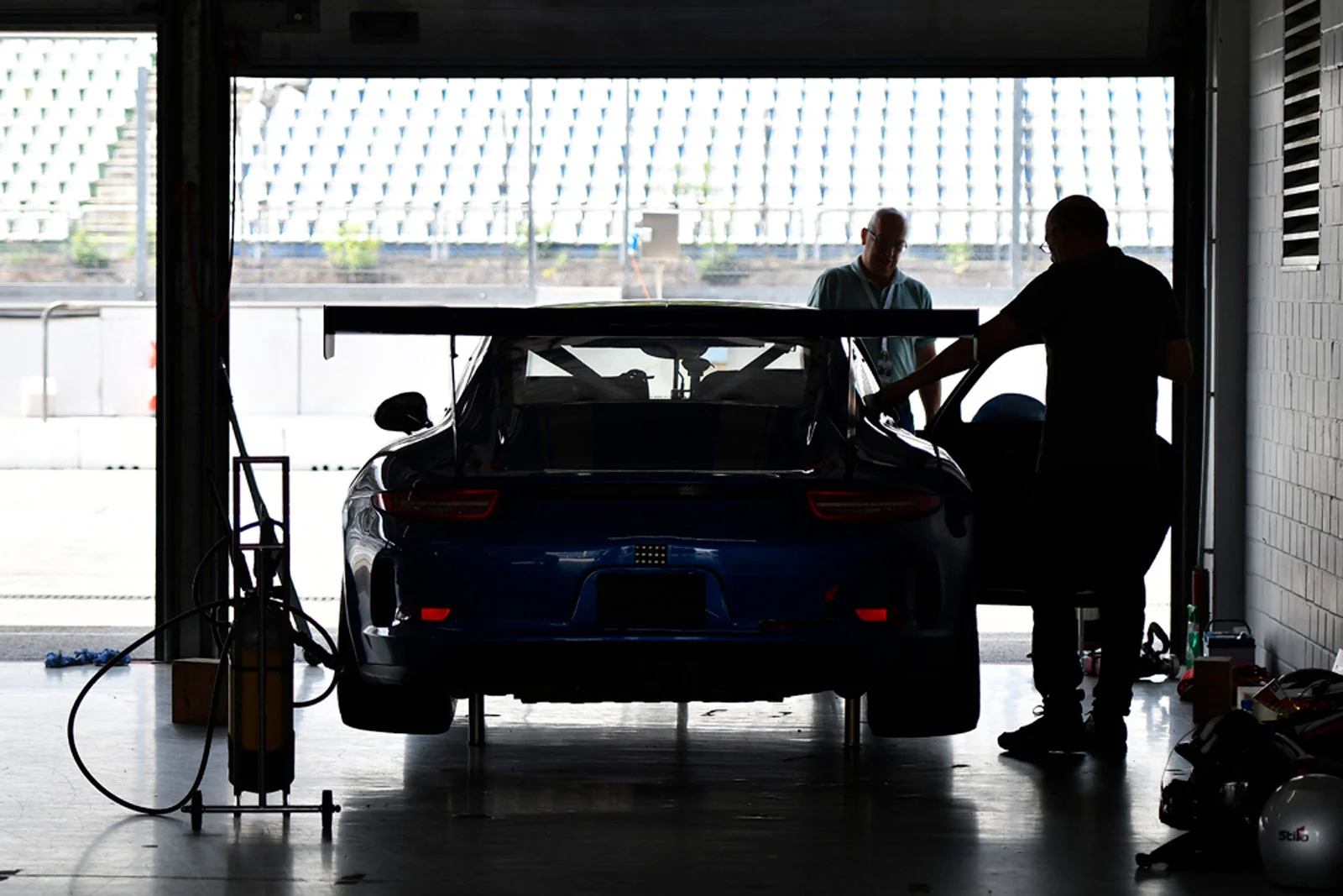 ESC mechanics in the paddock preparing Porsche GT3 for track day – professional service included