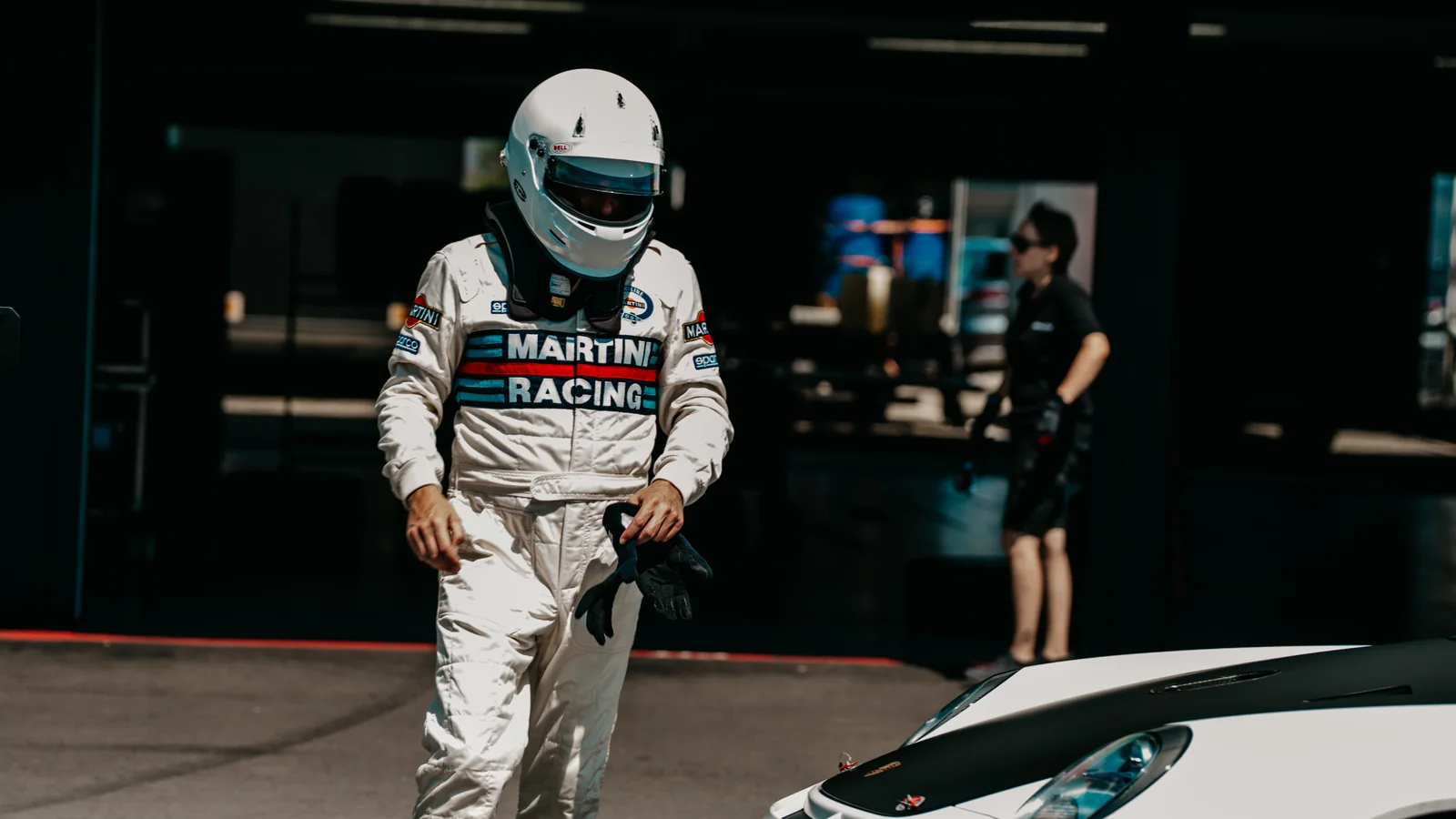Driver in a racing suit in the pit lane at the Hockenheimring