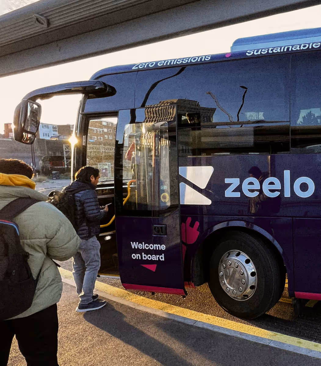 Workers queueing outside their workplace to board the Zeelo bus