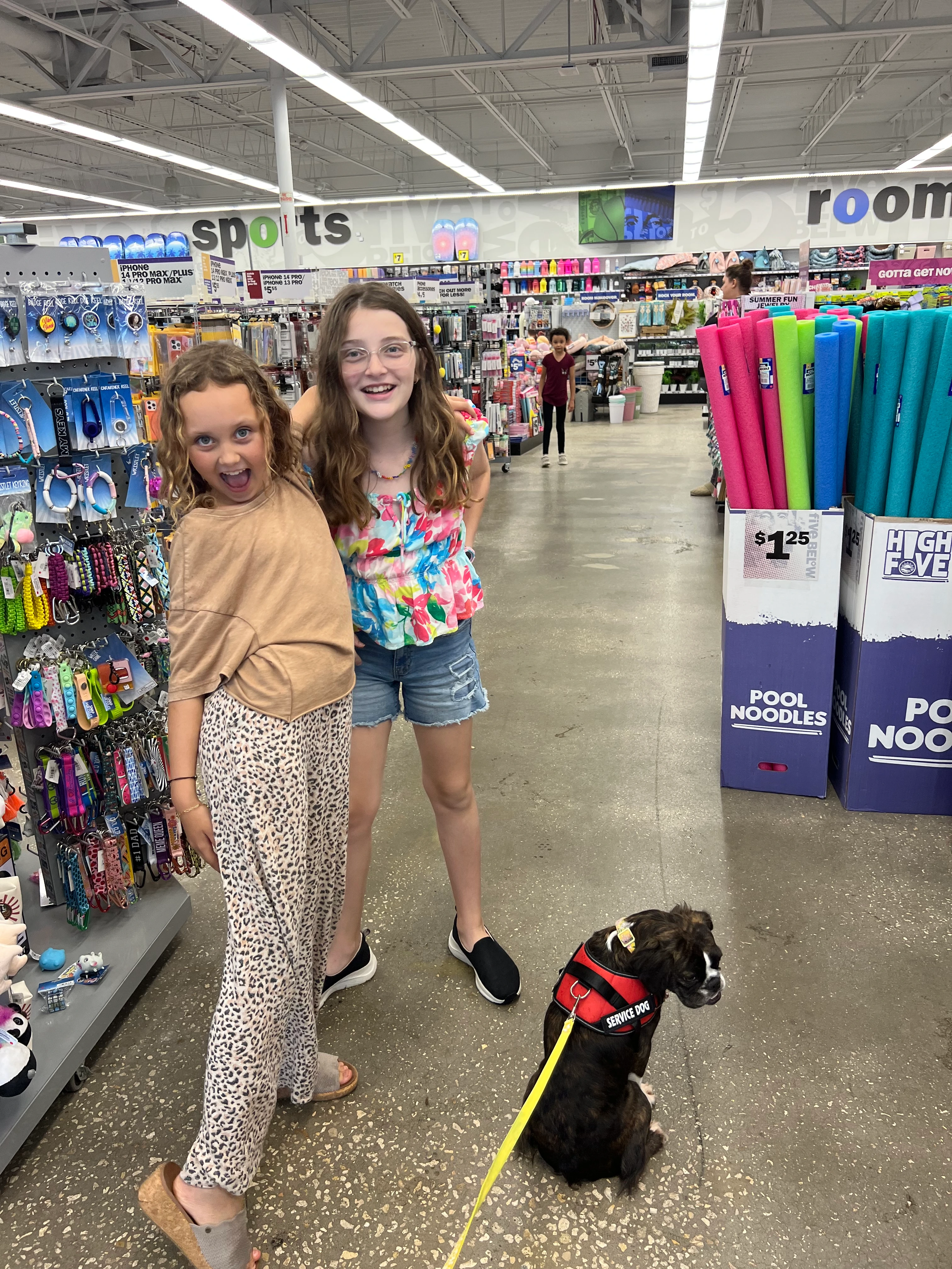 Two girls shopping in a store with their Royal Frenchel.