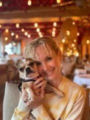 Owner hugging and snuggling their Royal Frenchel.