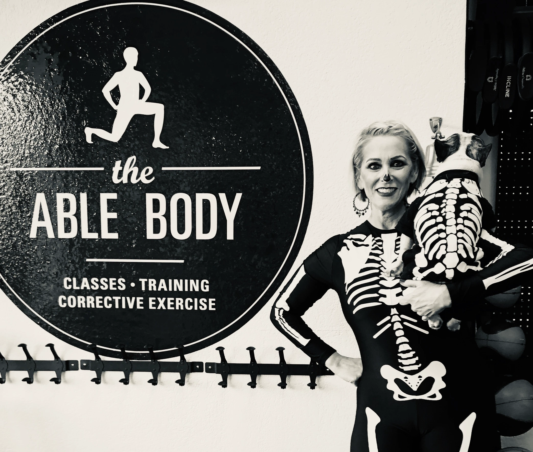 Royal Frenchel and owner wearing matching skeleton costumes together.